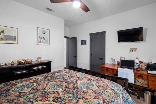 bedroom featuring light hardwood / wood-style flooring and ceiling fan