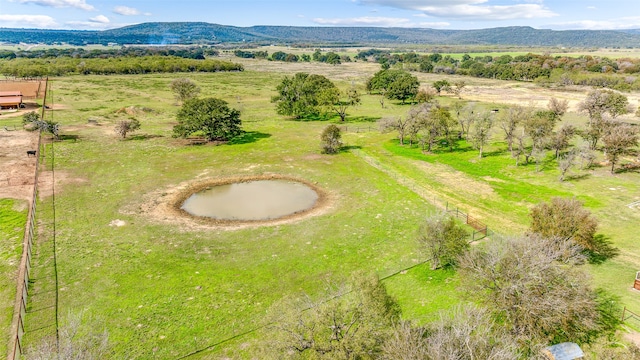 birds eye view of property with a mountain view and a rural view