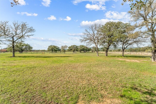 view of yard with a rural view