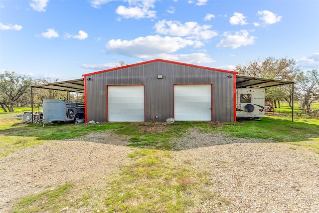 garage featuring a carport