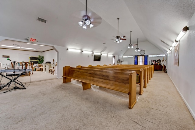 game room with light colored carpet, ceiling fan, and lofted ceiling