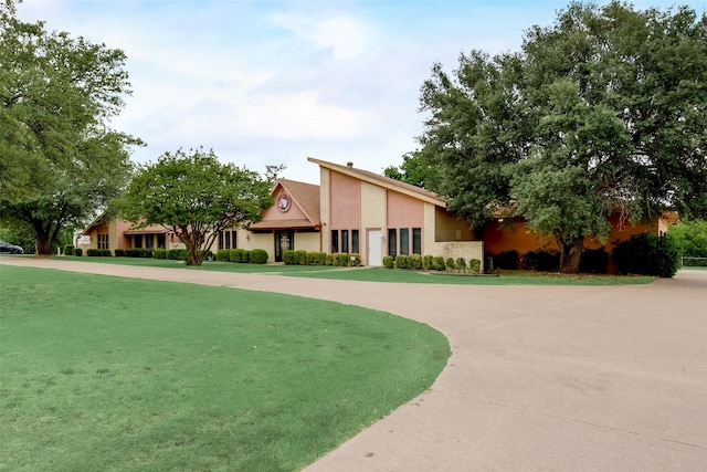 view of property's community with a yard