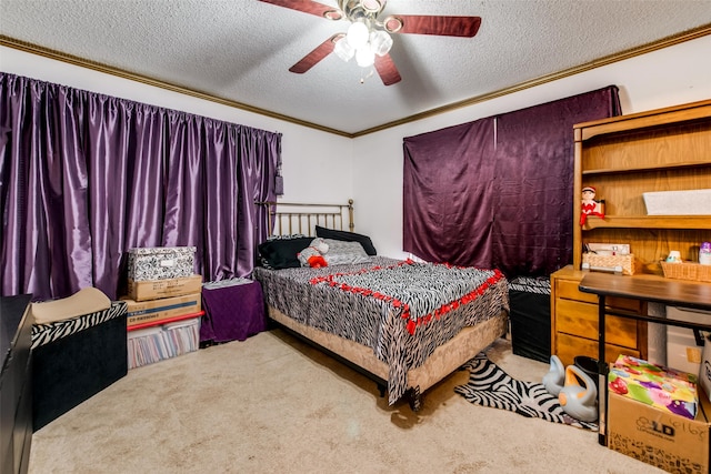 carpeted bedroom featuring a textured ceiling, ceiling fan, and ornamental molding