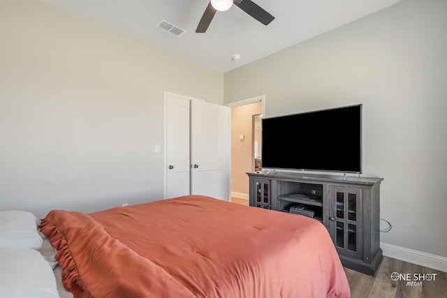 bedroom with ceiling fan and hardwood / wood-style floors