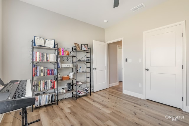 miscellaneous room featuring ceiling fan and light hardwood / wood-style floors