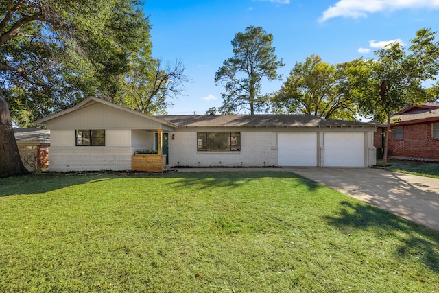 ranch-style home with a garage and a front lawn