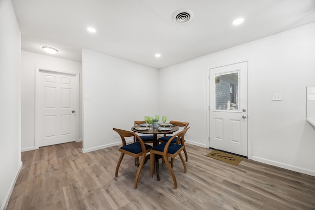 dining room with light hardwood / wood-style floors