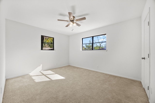 carpeted empty room with ceiling fan