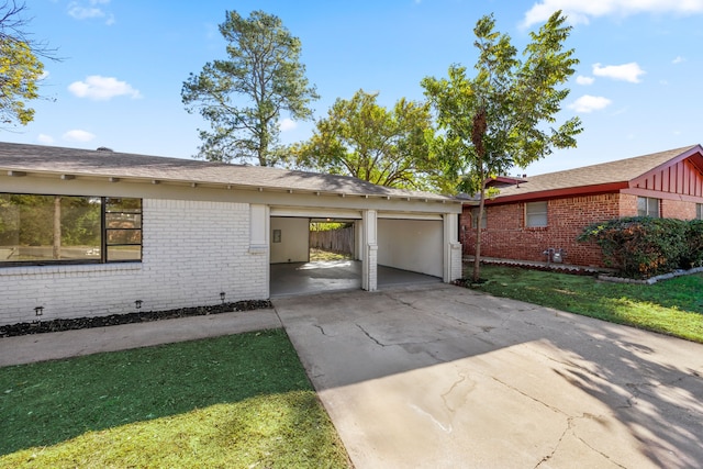 view of side of property with a carport