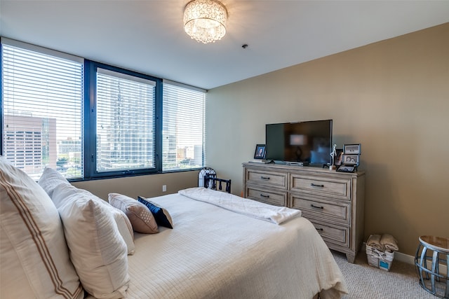 bedroom featuring light carpet