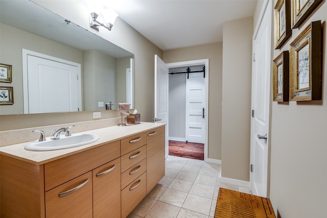 bathroom featuring tile patterned flooring and vanity