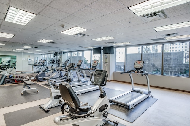 workout area featuring a paneled ceiling