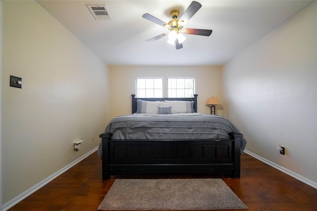 bedroom with ceiling fan and dark hardwood / wood-style flooring