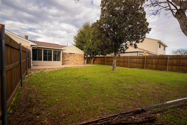 view of yard with a sunroom