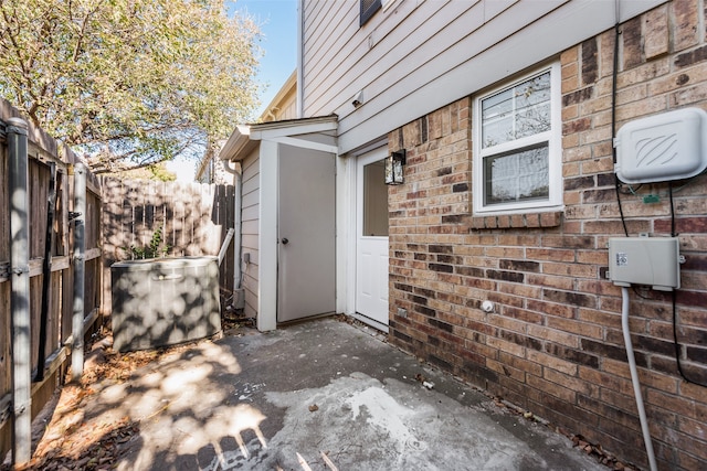 doorway to property with a patio area