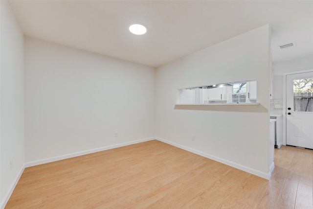 empty room with light wood-type flooring