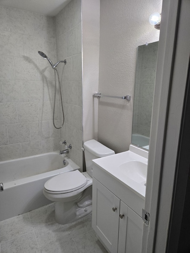 full bathroom with toilet, vanity, and tiled shower / bath combo