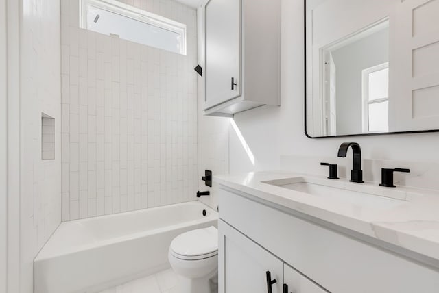 bathroom featuring toilet, tile patterned flooring,  shower combination, and vanity