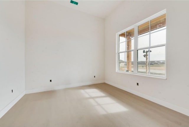 spare room with light hardwood / wood-style floors