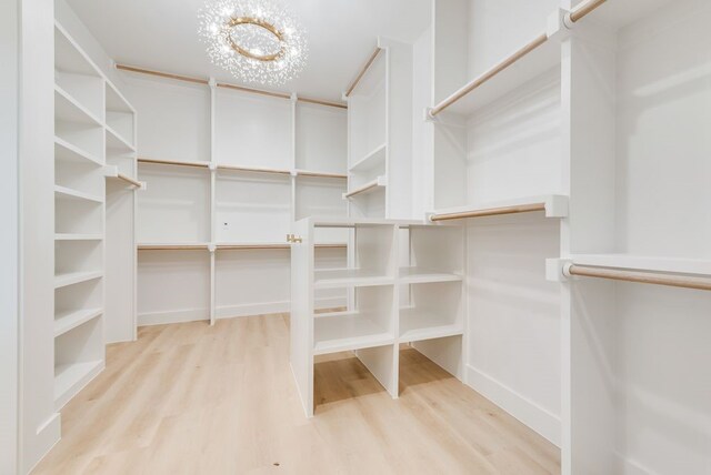 living room with built in shelves, beam ceiling, high vaulted ceiling, and light carpet