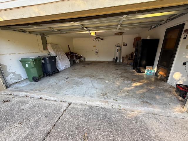 garage with electric water heater and a garage door opener