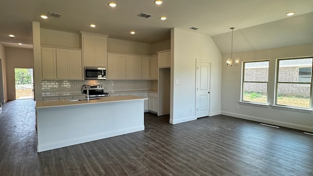 kitchen featuring white cabinets, stainless steel appliances, dark hardwood / wood-style floors, and lofted ceiling