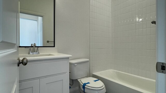 full bathroom featuring vanity, toilet, and  shower combination