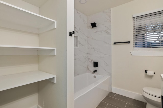 full bathroom with tile patterned flooring, vanity, toilet, and tiled shower / bath