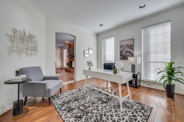 office with crown molding, plenty of natural light, and hardwood / wood-style flooring