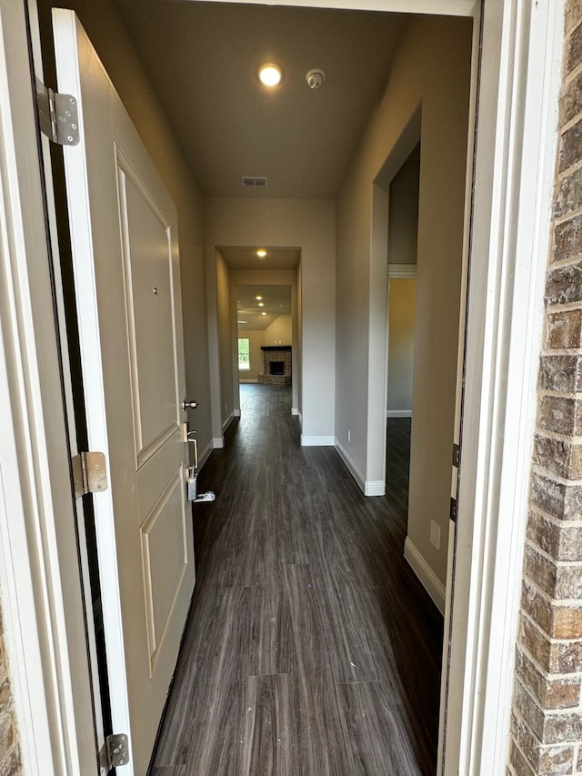 hall with dark wood-type flooring