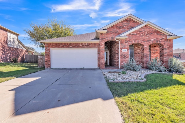 front facade with a garage and a front yard