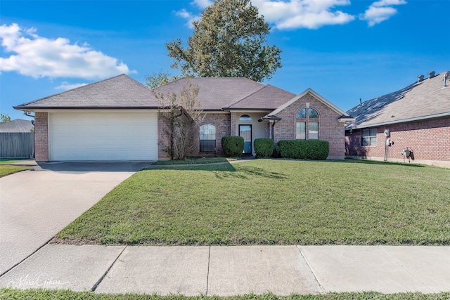 ranch-style house with a garage and a front lawn