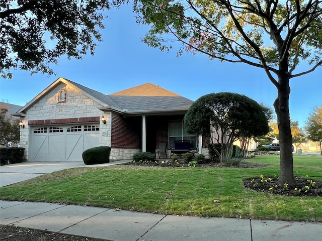 view of front of home featuring a garage and a front lawn