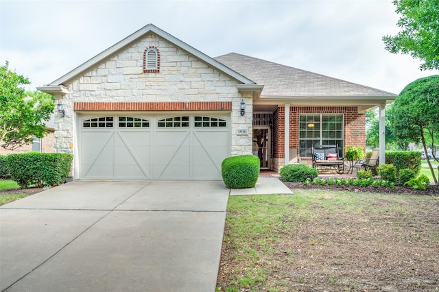 view of front of house with a garage and a porch