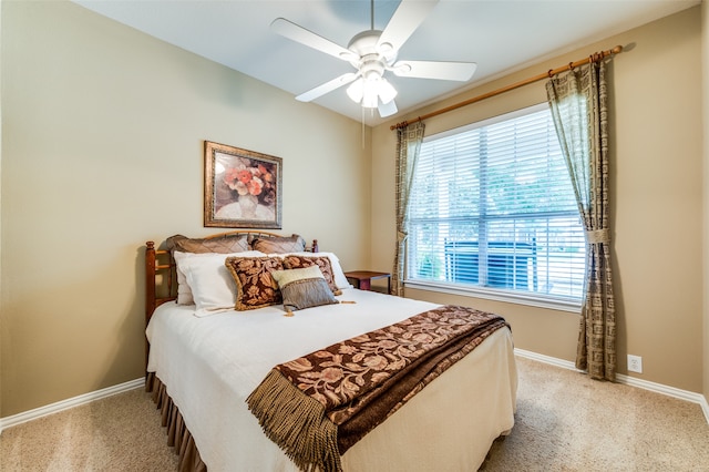 bedroom featuring ceiling fan and light carpet