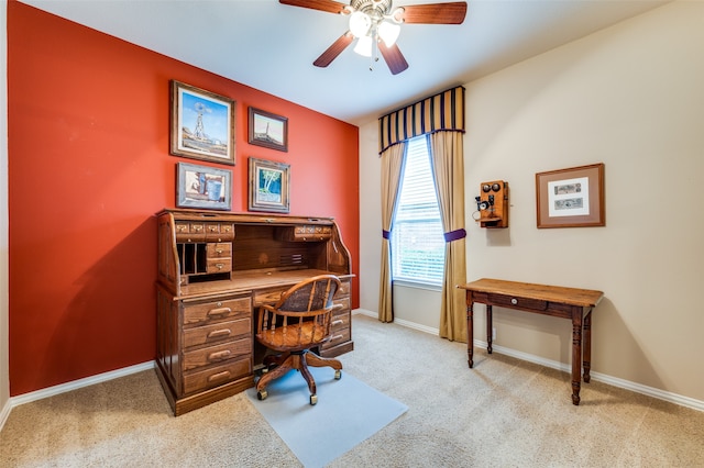 office space featuring ceiling fan and light colored carpet