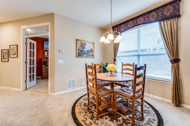 dining room with a chandelier and a wealth of natural light