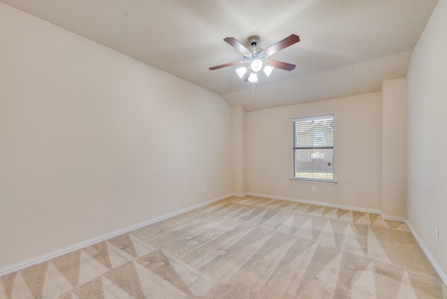 empty room with ceiling fan and light colored carpet