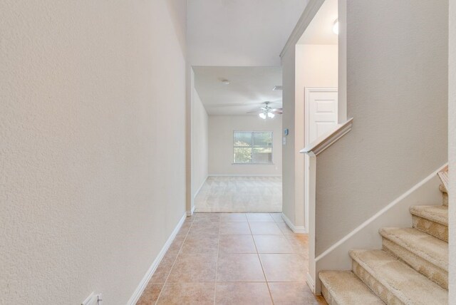 unfurnished living room featuring baseboards, recessed lighting, ceiling fan, and light carpet
