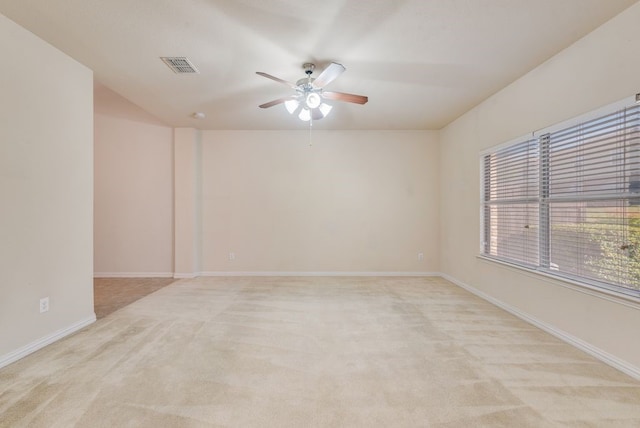 unfurnished room with ceiling fan and light colored carpet