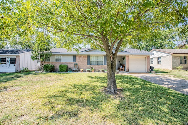 single story home featuring a front lawn and a garage