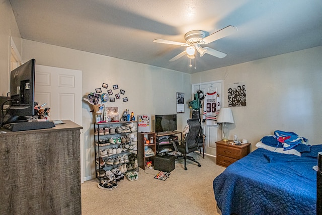 carpeted bedroom featuring ceiling fan