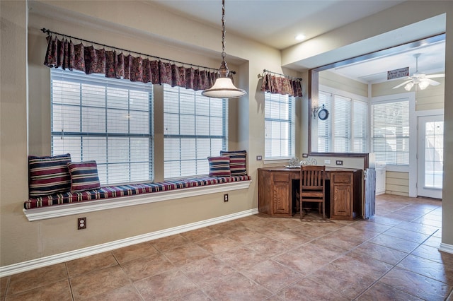 unfurnished office with ceiling fan and light tile patterned floors