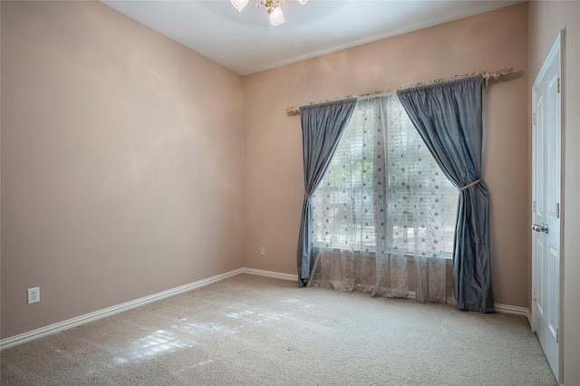 unfurnished room featuring carpet