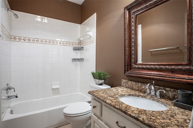 full bathroom with vanity, toilet, and tiled shower / bath combo