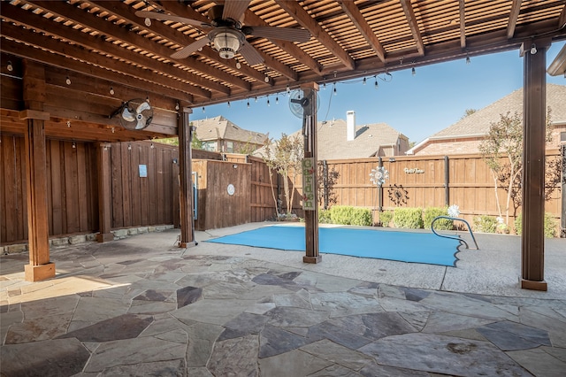 exterior space with ceiling fan, a pergola, and a patio