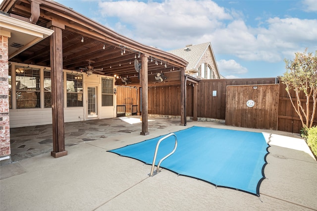 view of swimming pool with a patio area and ceiling fan