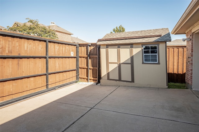 view of patio / terrace featuring a storage unit