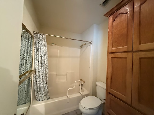 bathroom with shower / bath combination with curtain and toilet