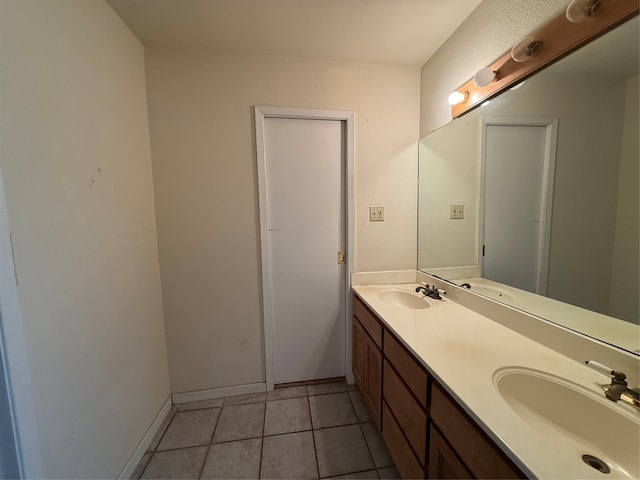 bathroom with tile patterned floors and vanity